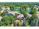 A charming single-story home surrounded by mature trees and landscaping, featuring a cozy outdoor patio at 8845 W 81St Dr, Arvada, CO 80005