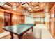 Spacious game room with a ping pong table and stunning paneled walls and ceiling at 8845 W 81St Dr, Arvada, CO 80005