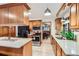 Bright kitchen featuring custom wood cabinetry, a stainless steel oven, and updated countertops at 8845 W 81St Dr, Arvada, CO 80005