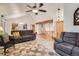 Bright living room with vaulted ceilings, a ceiling fan, and access to the staircase at 8845 W 81St Dr, Arvada, CO 80005