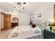 Comfortable primary bedroom featuring a ensuite bathroom and wood-look floors at 8845 W 81St Dr, Arvada, CO 80005