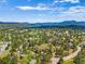 Breathtaking aerial view showcasing the beautiful community surrounded by lush greenery and mountains at 2140 Torrey Pine Dr, Evergreen, CO 80439