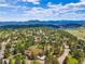 Beautiful aerial view of the neighborhood showcasing lush greenery and mountainous landscape at 2140 Torrey Pine Dr, Evergreen, CO 80439