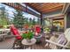 Beautiful back deck with fire pit and scenic views at 2140 Torrey Pine Dr, Evergreen, CO 80439