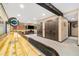 Spacious basement featuring a shuffleboard table and entertainment area at 2140 Torrey Pine Dr, Evergreen, CO 80439