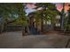 Charming two-story home featuring a stone facade, a spacious driveway, mature trees, and a welcoming entrance at 2140 Torrey Pine Dr, Evergreen, CO 80439