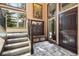 Grand entry with a charming bench, beautiful tile floors, lots of natural light, and views of the outdoors at 2140 Torrey Pine Dr, Evergreen, CO 80439