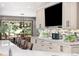 Modern kitchen showcasing updated cabinets, stainless appliances, hardwood floors, and eat in breakfast nook at 2140 Torrey Pine Dr, Evergreen, CO 80439