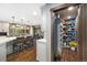 Well-equipped kitchen featuring a large island with seating and a walk-in pantry for extra storage at 2140 Torrey Pine Dr, Evergreen, CO 80439