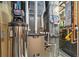 Well-maintained utility room featuring a modern furnace and hot water heater at 2140 Torrey Pine Dr, Evergreen, CO 80439