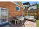 Backyard patio area showcases outdoor furniture and a fenced in yard at 3437 W 35Th Ave, Denver, CO 80211