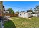 Backyard shows a detached garage with fenced yard and a stone patio area at 3437 W 35Th Ave, Denver, CO 80211