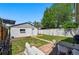 Detached garage and patio area with outdoor furniture complete the back yard at 3437 W 35Th Ave, Denver, CO 80211