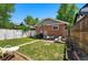 Well maintained backyard featuring a patio with outdoor seating and lush green grass at 3437 W 35Th Ave, Denver, CO 80211