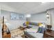 Finished basement with stylish sectional sofa, modern decor, and bright lighting at 3437 W 35Th Ave, Denver, CO 80211