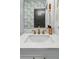 Bright bathroom with a marble countertop and brass fixtures at 3437 W 35Th Ave, Denver, CO 80211