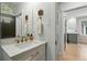 Stylish bathroom features a vanity with a quartz countertop and sleek fixtures at 3437 W 35Th Ave, Denver, CO 80211
