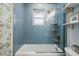 Modern bathroom featuring a blue tiled shower and tub combination at 3437 W 35Th Ave, Denver, CO 80211