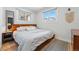 Bright bedroom featuring a modern bed, wood floors and an inviting atmosphere at 3437 W 35Th Ave, Denver, CO 80211