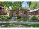 Charming brick home featuring a well-manicured lawn and inviting front porch area at 3437 W 35Th Ave, Denver, CO 80211