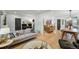 Open living space with hardwood floors, modern furniture, and adjoining dining area at 3437 W 35Th Ave, Denver, CO 80211