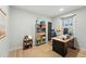 Cozy home office featuring a large desk, bookshelf, and ample natural light at 3437 W 35Th Ave, Denver, CO 80211