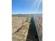A view of the spacious backyard with a newly installed fence and trees at 1800 Vantage Pkwy, Berthoud, CO 80513