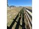 The backyard shows a wood fence and natural landscape in a neighborhood setting at 1800 Vantage Pkwy, Berthoud, CO 80513
