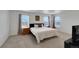 Comfortable bedroom features plush carpeting, natural light, and neutral decor at 1800 Vantage Pkwy, Berthoud, CO 80513