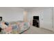 Bedroom with plush carpet, TV, and bright quilt, creating a cozy atmosphere at 1800 Vantage Pkwy, Berthoud, CO 80513