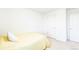 Bright bedroom features neutral carpet, white walls and a bed with yellow comforter at 1800 Vantage Pkwy, Berthoud, CO 80513