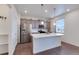 Modern kitchen features stainless steel appliances, center island, and granite countertops at 1800 Vantage Pkwy, Berthoud, CO 80513