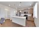 Modern kitchen featuring gray cabinets, stainless steel appliances, white countertops, and a spacious island at 1800 Vantage Pkwy, Berthoud, CO 80513