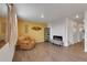 A cozy living room with wood floors, a modern fireplace, a comfortable recliner, and unique decorative wall art at 1800 Vantage Pkwy, Berthoud, CO 80513