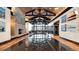 Lobby with grand vaulted ceiling, stone fireplace, and shiny hardwood flooring at 1800 Vantage Pkwy, Berthoud, CO 80513