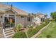 Backyard landscaping with steps, low brick wall, and sliding glass door at 3104 Newport Cir, Castle Rock, CO 80104