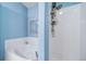 Bathroom featuring a large soaking tub, a separate shower and blue walls at 3104 Newport Cir, Castle Rock, CO 80104