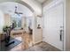 Bright entryway with hardwood floors, a view into the adjacent room, and a stylish front door at 3104 Newport Cir, Castle Rock, CO 80104