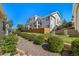 Exterior view of a multi-story building with balconies, a wood fence, and landscaping at 3104 Newport Cir, Castle Rock, CO 80104