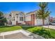 Charming home with a well-manicured lawn and a cozy front porch with decorative elements at 3104 Newport Cir, Castle Rock, CO 80104