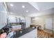 Well-lit kitchen with white cabinets, granite countertops, and stainless steel appliances at 3104 Newport Cir, Castle Rock, CO 80104