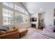 Inviting living room with lots of natural light, plush seating, and a cozy fireplace at 3104 Newport Cir, Castle Rock, CO 80104