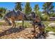 Outdoor statue featuring a bronze horse and cowboy figure set among rocks and landscaping at 3104 Newport Cir, Castle Rock, CO 80104