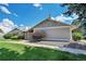 Side view of the house showcasing its landscaping and stone accents at 10321 E Evans Se Ave # 176, Aurora, CO 80247