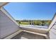 This is a view from the balcony with a roof that overlooks a pond and green space at 17003 E Tennessee Dr # 209, Aurora, CO 80017