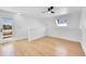 Bedroom with hardwood floors, ceiling fan, and access to outdoor patio with glass door at 17003 E Tennessee Dr # 209, Aurora, CO 80017