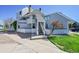 Inviting condo exterior featuring a private entrance and well-kept landscaping at 17003 E Tennessee Dr # 209, Aurora, CO 80017