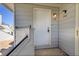 Close-up of the unit's front door entrance with visible unit numbers and modern hardware at 17003 E Tennessee Dr # 209, Aurora, CO 80017