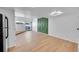 Bright living room with hardwood floors, sliding glass doors, and unique decorative wall accents at 17003 E Tennessee Dr # 209, Aurora, CO 80017