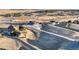 Aerial view of a community with a pond and lush greenery at 19647 Guildford Ct, Monument, CO 80132